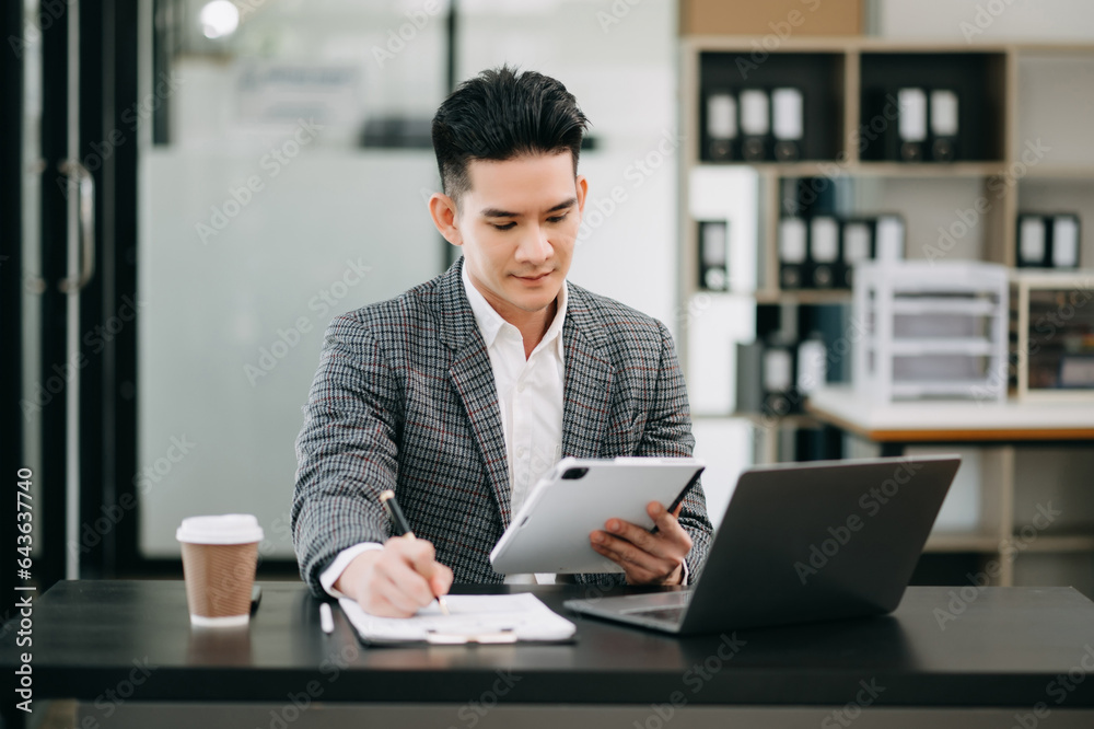 Mature business man executive manager looking at laptop watching online webinar training or having virtual meeting video conference doing market research working in office..