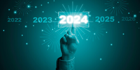 Hand touching to 2024 year with bokeh for preparation merry Christmas and happy new year concept.