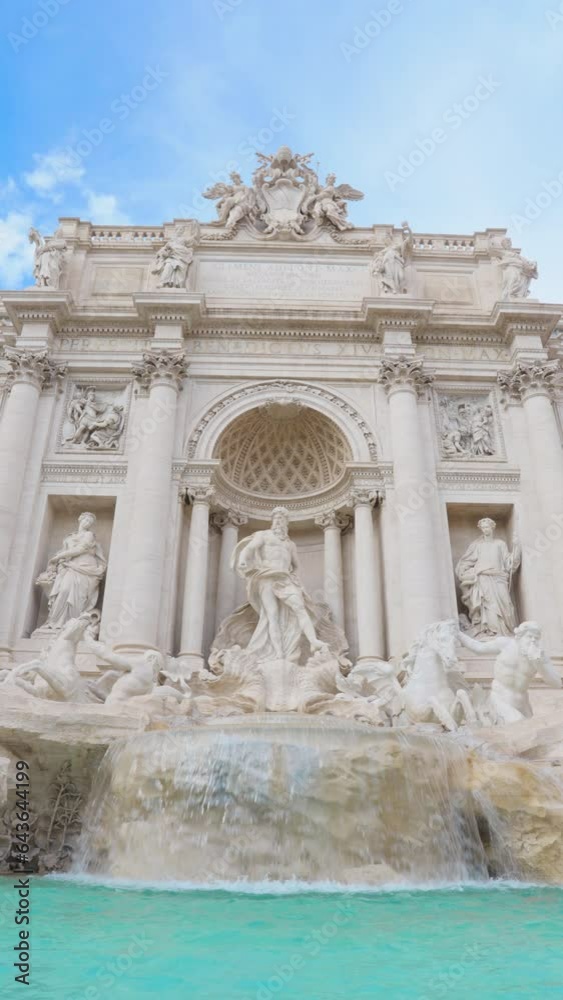 The Fontana di Trevi, baroque landmark located in centre of Rome, Italy. Famous tourist attraction in Roma, Italia. Trevi Fountain in sunny day. Europe travel destination. Vertical mobile screen. The Fontana di Trevi, baroque landmark located in centre of Rome, Italy. Famous tourist attraction in Roma, Italia. Trevi Fountain in sunny day. Europe travel destination. Vertical mobile screen.