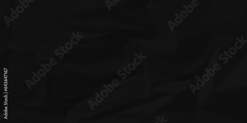 Crumpled paper texture dark black crumpled paper texture crush paper so that it becomes creased and wrinkled. Old black crumpled paper sheet background texture.	