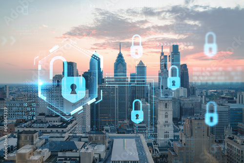 Aerial panoramic cityscape of Philadelphia financial downtown, Pennsylvania, USA. City Hall Clock Tower, sunset. Padlock hologram. The concept of cyber security to protect confidential information