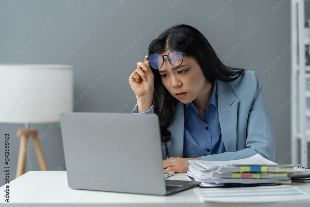 tired business woman sleepy and bored from sitting at a desk for a long time and has office syndrome tired business woman sleepy and bored from sitting at a desk for a long time and has office syndrome