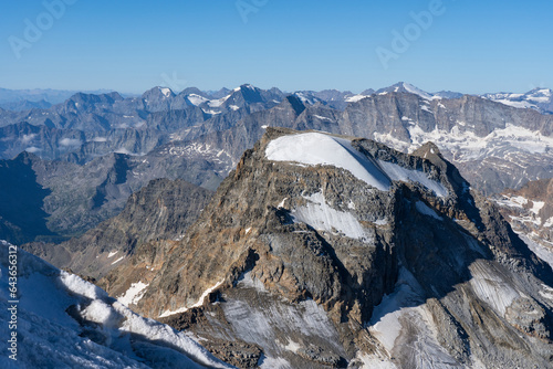 View from the top of Gran Paradiso (National Park) mountain glacier, Italian Alps. Tresenta, Ciarforon, Levanne, Ciamarella peaks landscape.
