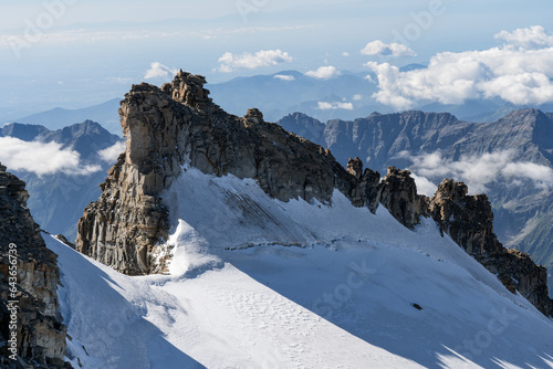 View from the peak of Gran Paradiso (National Park) mountain, Italian Alps. Destination of mountaineers climbing Gran Paradiso glacier to the summit of the mountain.