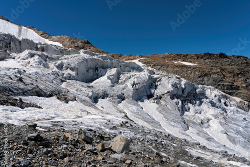 Glacier in the alpine mountains, crevasses and ice details. Gran Paradiso National Park mountaineering. global warming melting the ice.