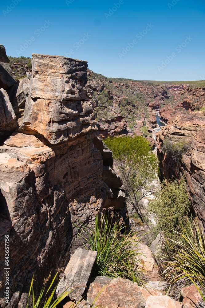 View of a narrow gorge created by Murchison River in Kalbarri National Park, Western Australia. Sandy and rocky terrain of Murchison River Gorge. Famous Western Australia tourism destination. 