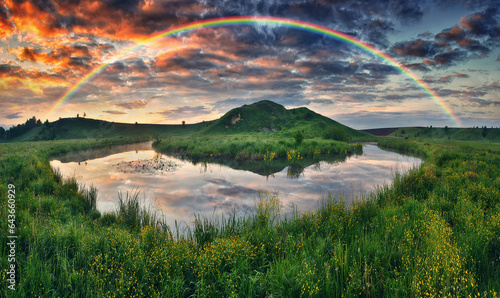 Landscape with a Rainbow on the River in Spring. colorful morning. nature of Ukraine © sergnester