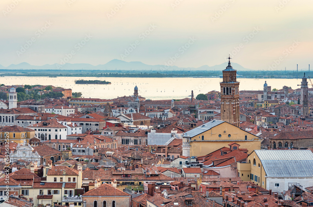 Aerial view with medieval red tiles roof houses in Venice.
