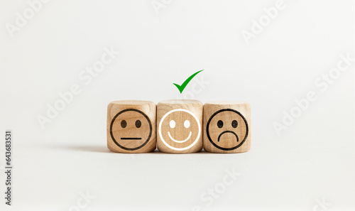 User service feedback, rating customer review, poll, satisfaction survey concept. Wooden blocks with facial expressions