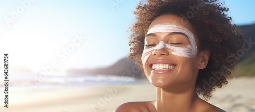 Biracial woman at beach app...