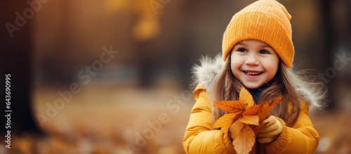 Young girl gathers autumn l...