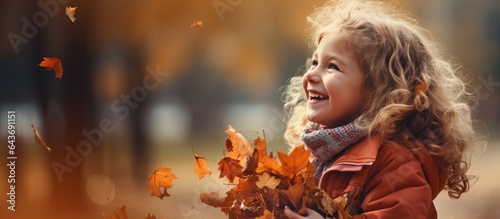 Young girl gathers autumn l...