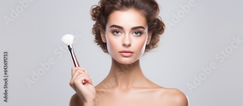 Young woman applying make u...