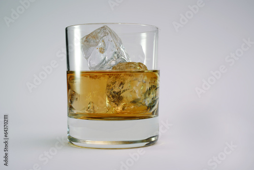 Cocktail whiskey alcohol drink with ice on the rocks