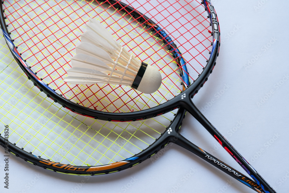Doha, Qatar August 4, 2023 Yonex badminton racket and shuttlecock on white background Stock