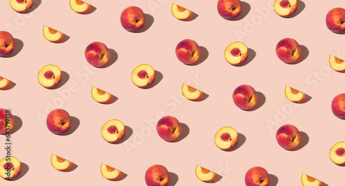 Colorful pattern of fresh ripe whole and sliced peaches