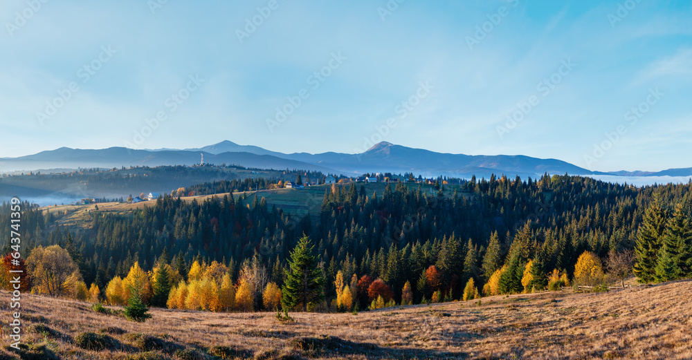 Morning slopes of the Carpathian Mountains (Yablunytsia village, Ivano-Frankivsk oblast, Ukraine). Autumn rural landscape. Two shots stitch high-resolution panorama.