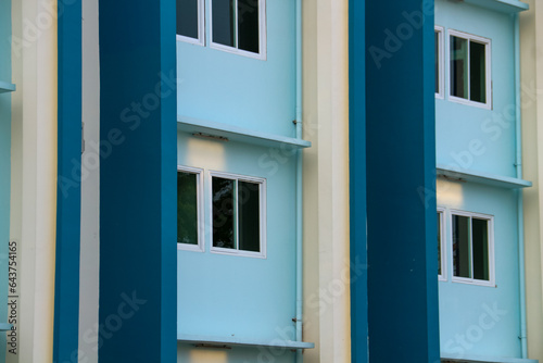 Colorful windows on the facade of a building in the city.