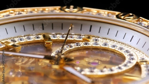 gear drive motion in skeleton watch. Mechanical watches with gears and cogs. clock mechanism. Clockwork details and parts. Inside watch, mechanical watch in macro view. expensive watch with diamonds