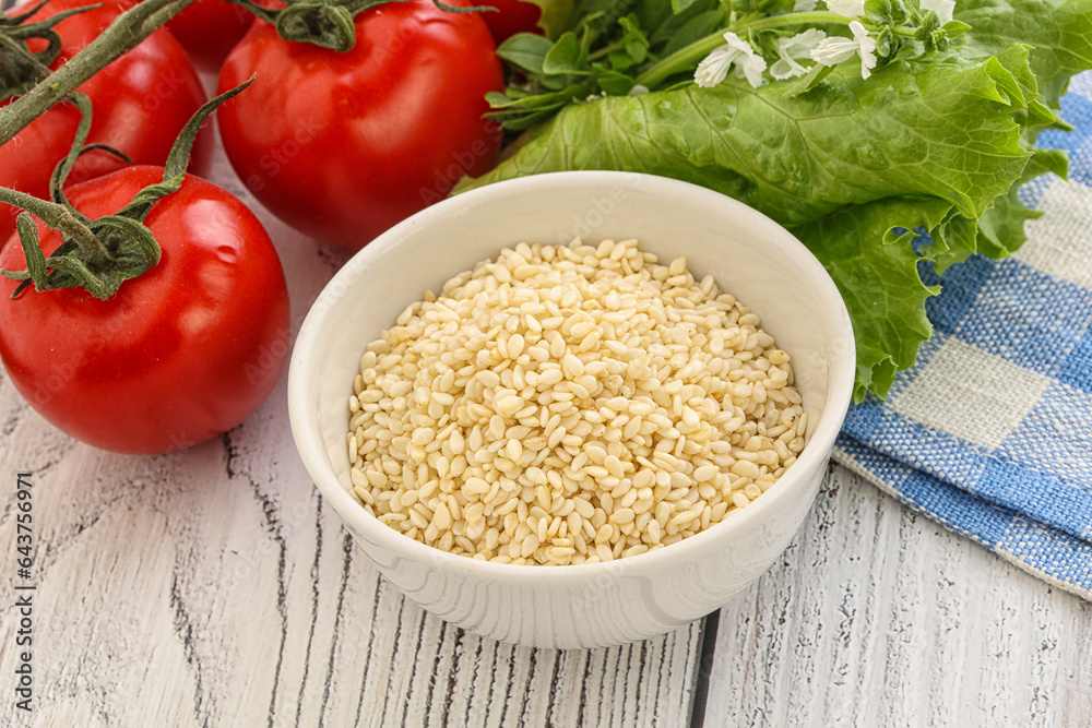 Raw sesame seeds in the bowl Raw sesame seeds in the bowl