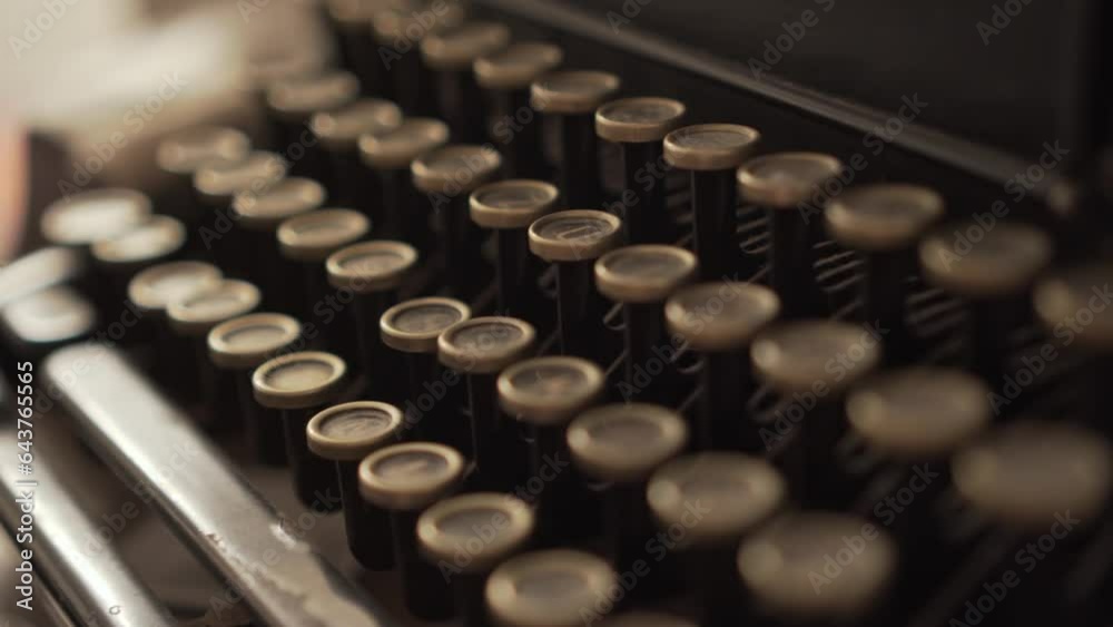 4k close-up of a person typing on a vintage typewriter. Person pressing keys on an old typewriter. 4k close-up of a person typing on a vintage typewriter. Person pressing keys on an old typewriter.