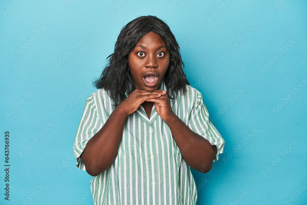 Young african american curvy woman praying for luck, amazed and opening mouth looking to front. Young african american curvy woman praying for luck, amazed and opening mouth looking to front.