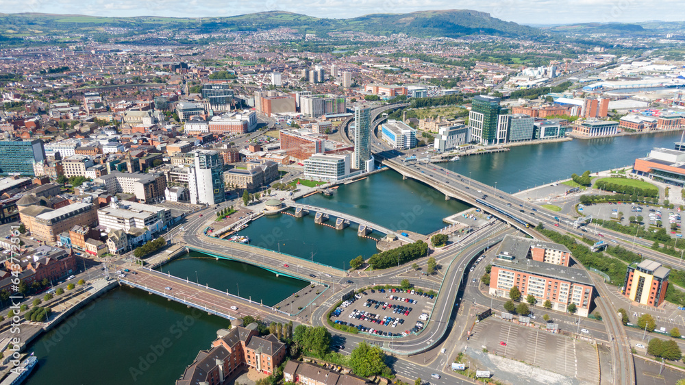 Obraz premium Aerial view on buildings and Lagan River in City center of Belfast Northern Ireland. Drone photo, high angle view of town