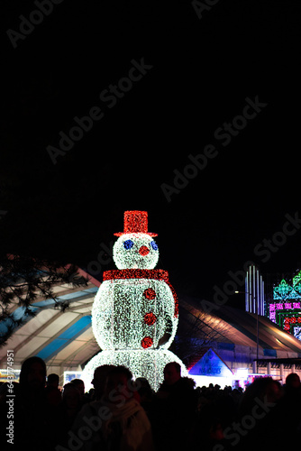 The city of Torrejon de Ardoz in Madrid, Spain celebrates Christmas by illuminating its streets with lights and Christmas decorations. Image of the snowman in the Torrejón de Ardoz park. photo