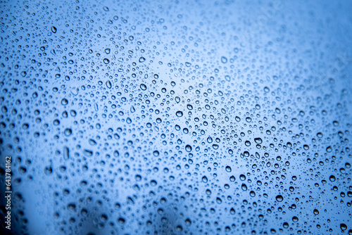 a close up of water droplets on a glass