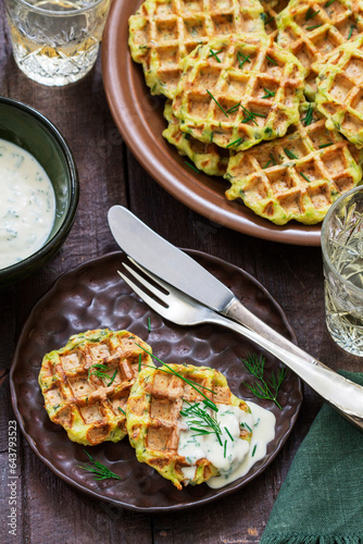 Zucchini wafers with dill and onion, served with sour cream sauce and wine.