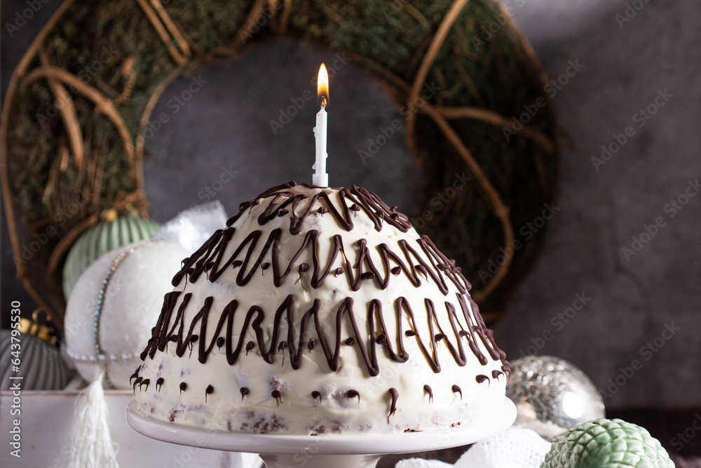 Pancho cake made of chocolate biscuit with sour cream and pineapple in New Year's or Christmas decoration. Rustic style.