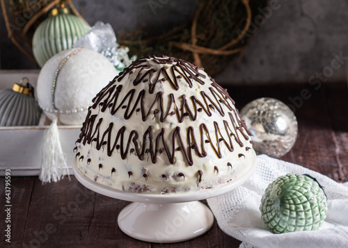 Obraz na płótnie Pancho cake made of chocolate biscuit with sour cream and pineapple in New Year's or Christmas decoration. Rustic style. w salonie
