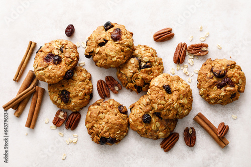 Oatmeal cranberry healthy homemade cookies with cinnamon and pecan nuts for breakfast photo