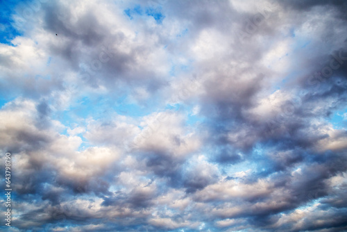 Clouds moving fast by windy weather.