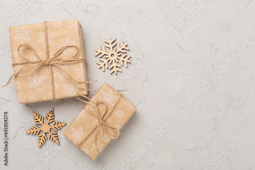 Craft christmas gift boxes on concrete background, top view