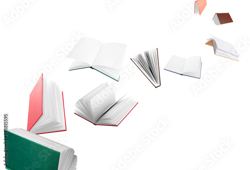 Many flying books on white background photo