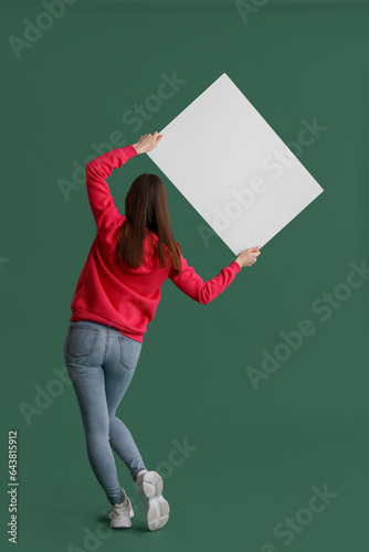 Young woman in hoodie with ...
