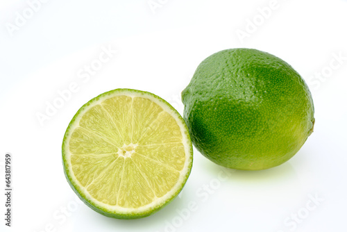 fresh juicy limes on white background
