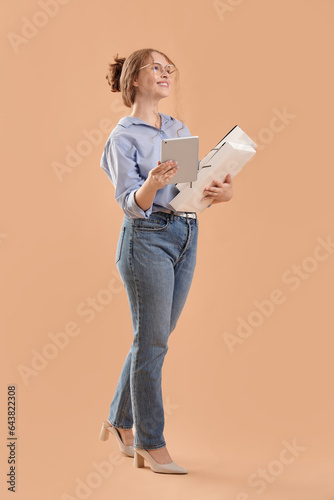 Young businesswoman with ta...