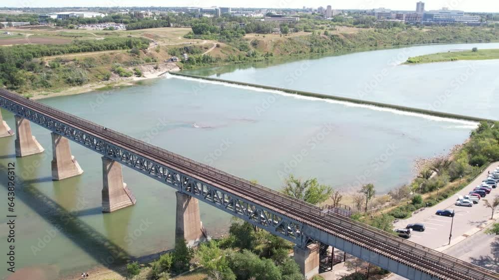 Aerial video of City Park, Saskatoon, SK, revealing its vibrant streets, urban green spaces, and historic architecture. A blend of city life and nature, ideal for urban exploration. Aerial video of City Park, Saskatoon, SK, revealing its vibrant streets, urban green spaces, and historic architecture. A blend of city life and nature, ideal for urban exploration.
