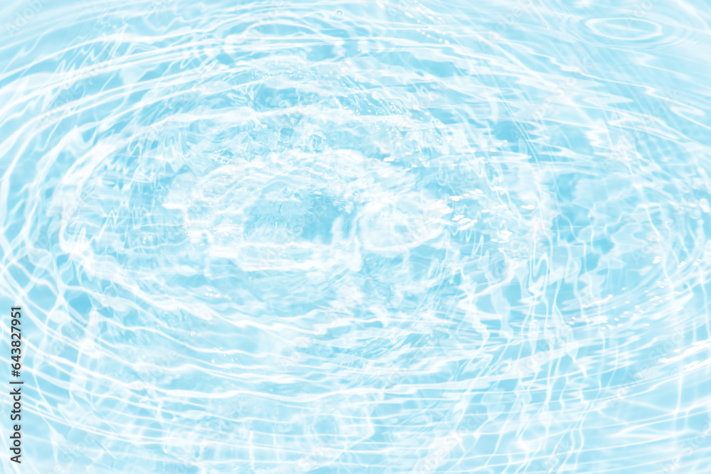 Blue water with ripples on the surface. Defocus blurred transparent blue colored clear calm water surface texture with splashes and bubbles. Water waves with shining pattern texture background. Blue water with ripples on the surface. Defocus blurred transparent blue colored clear calm water surface texture with splashes and bubbles. Water waves with shining pattern texture background.