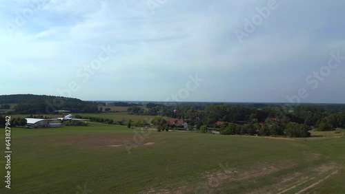 Best aerial top view flight drone. II-62 aircraft on ground. hilly summer fields photo