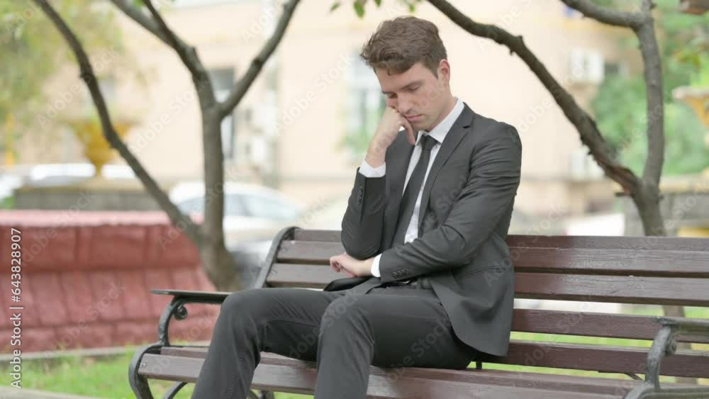 Tired Businessman Sleeping while Sitting on Bench Tired Businessman Sleeping while Sitting on Bench