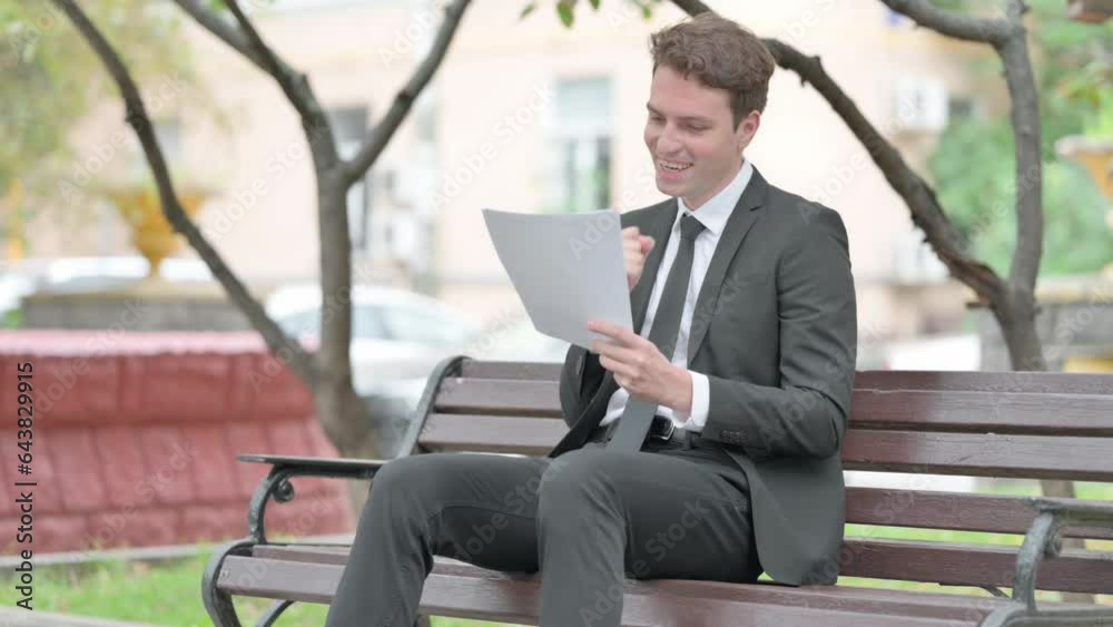 Businessman Celebrating and Reading Documents Outdoor Businessman Celebrating and Reading Documents Outdoor