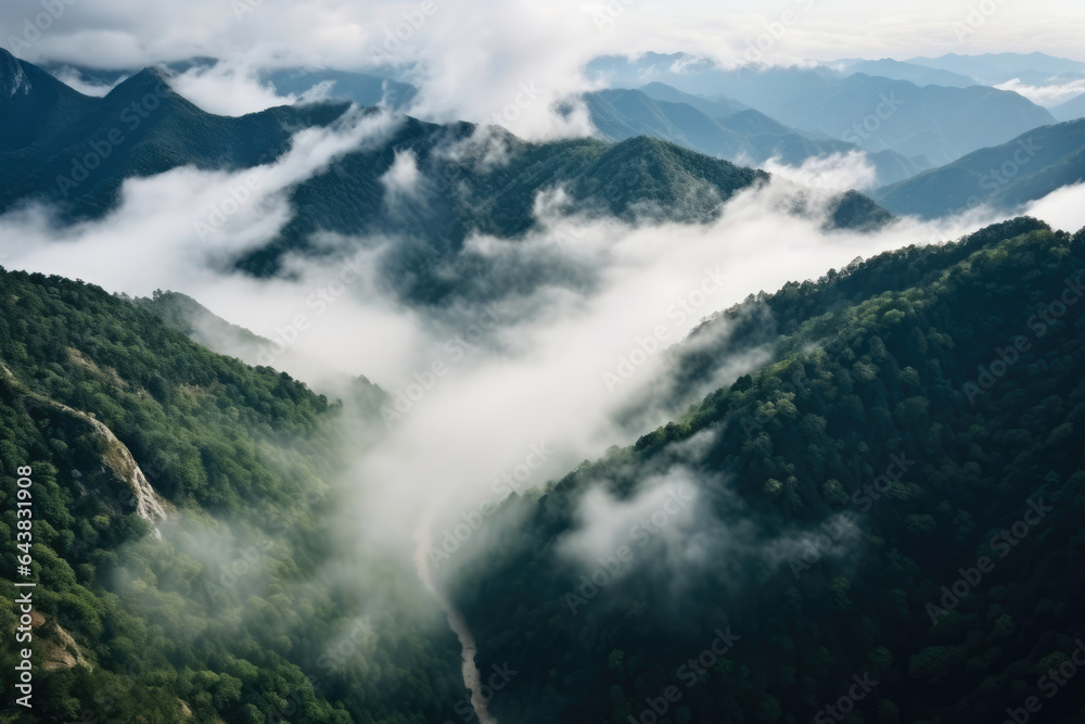 Mystical Mist-Clad Mountains: Awe-Inspiring Aerial Glimpse of Serene Wilderness and Tranquil Valleys