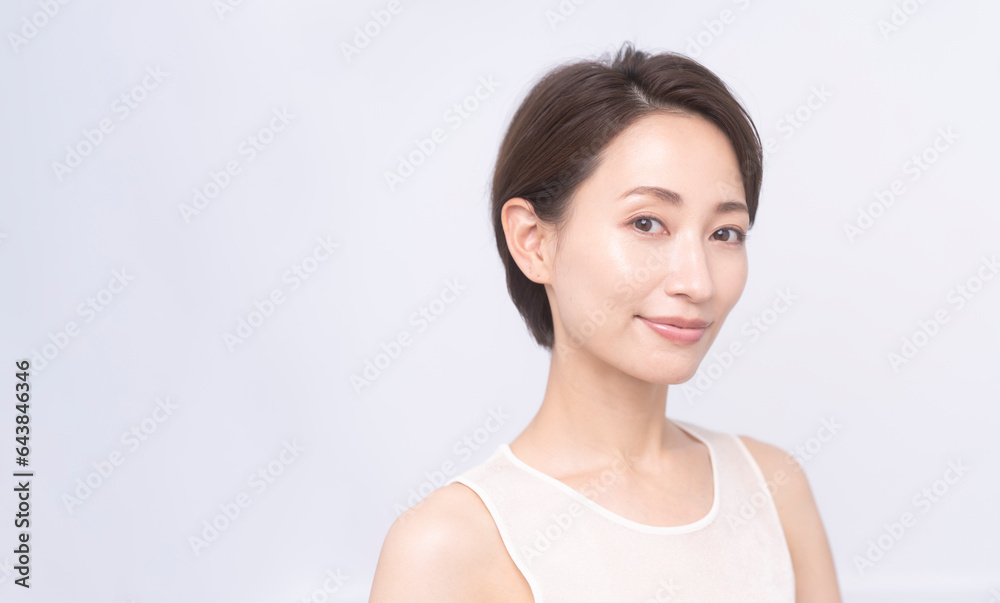 Skin care. Woman with beauty face touching healthy facial skin portrait. Asian woman.
Skin care. Woman with beauty face touching healthy facial skin portrait. Asian woman.
