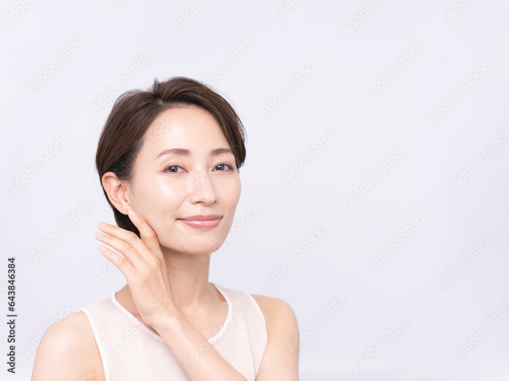 Skin care. Woman with beauty face touching healthy facial skin portrait. Asian woman.
Skin care. Woman with beauty face touching healthy facial skin portrait. Asian woman.