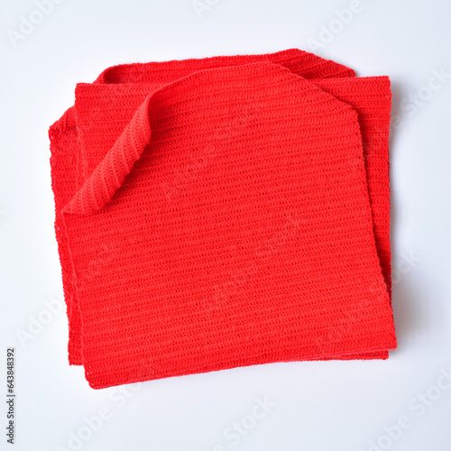 red wool knitted yarn texture, woolen fabric on white background