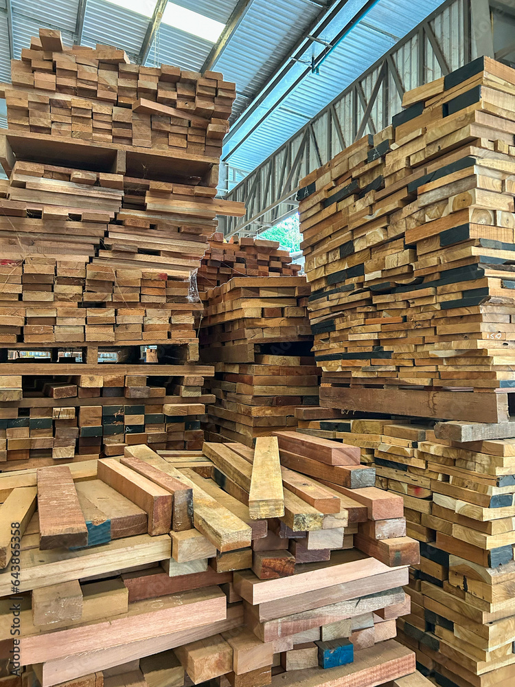 Woods stack in the sawmill. Pile of woods on shelves in factory Woods stack in the sawmill. Pile of woods on shelves in factory