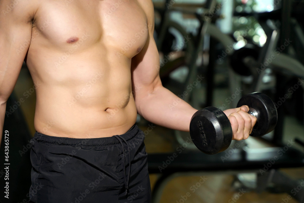Closeup and crop perfect body with weight training at fitness center. Closeup and crop perfect body with weight training at fitness center.
